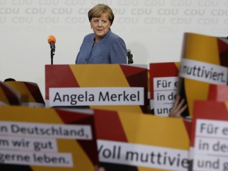 Merkelovej muž na dovolenke bez ženy. Kde je Angela?