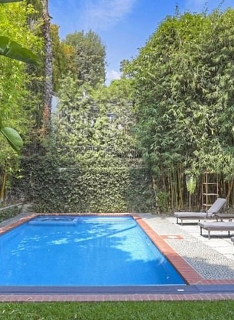 39385352-9268737-The_third_of_an_acre_lot_has_a_saltwater_pool_and_spa_and_lush_l-a-106_1613541599982