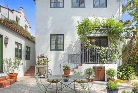 39385354-9268737-The_property_includes_a_converted_two_car_garage_that_offers_a_l-a-107_1613541600039