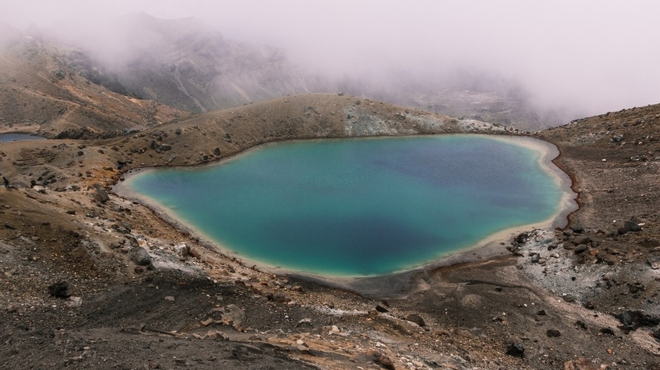 small-lake-middle-desert-near-mountain-foggy-day 