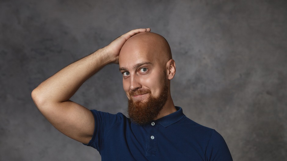 picture-handsome-cute-guy-with-bushy-beard-smiling-shyly-holding-hand-his-shaved-bald-head-asking-lovely-woman-date-portrait-happy-attractive-bearded-guy-feeling-proud-hairdo