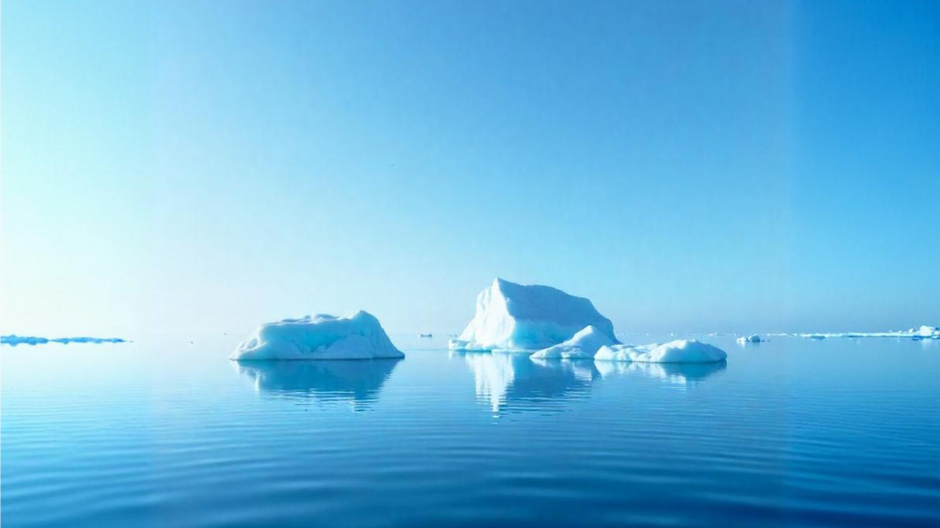 icebergs-floating-on-a-calm-reflective-ocean-under